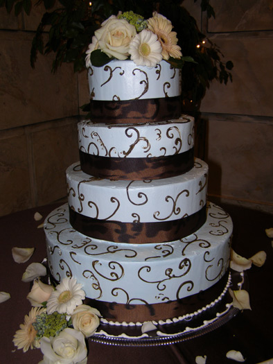 A display case showing a variety of freshly baked pies and desserts at Lisa Becker's Bakery