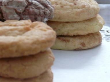 A large cookie tray filled with dozens of beautifully arranged homemade cookies ready for a party
