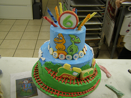 Custom specialty cake with intricate hand-piped designs