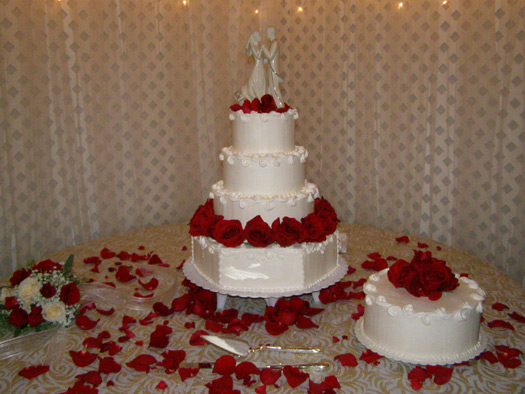 Wedding cake centerpiece at a reception celebration by Lisa Becker's Bakery
