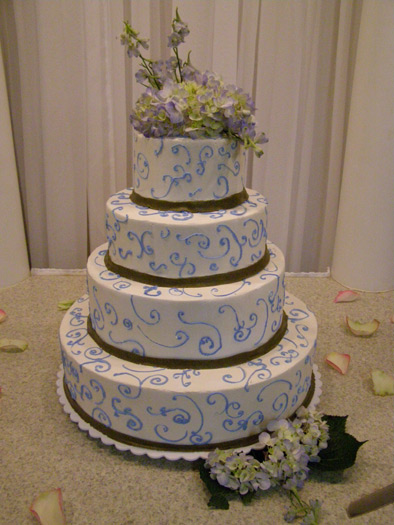 All-white wedding cake with textured buttercream design by Lisa Becker's Bakery
